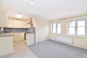 Open plan living room and kitchen - click for photo gallery